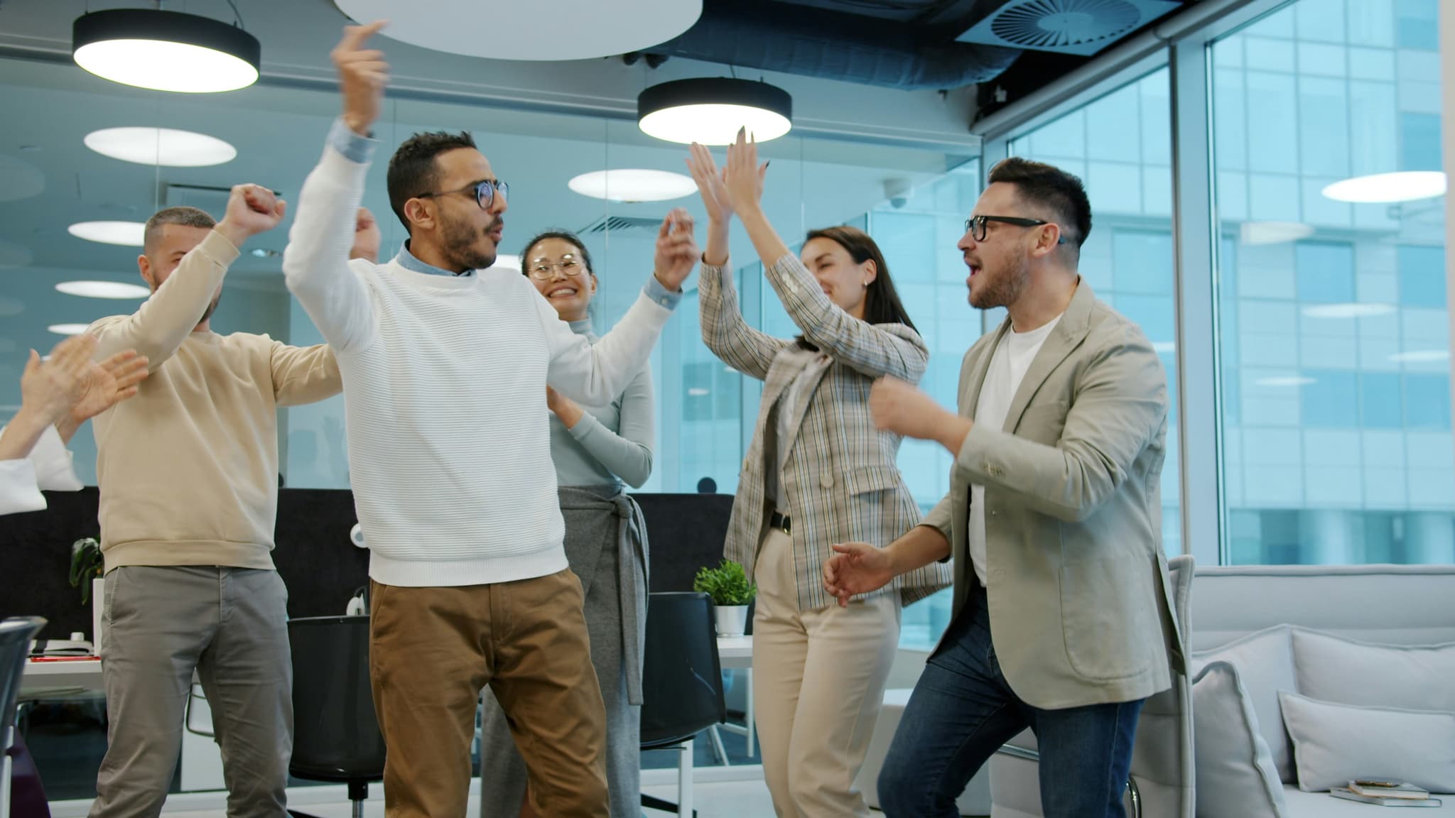 Team celebrating together at Journey to Laugh event